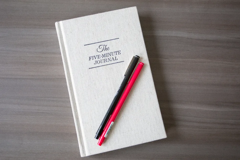 paper journal and pen on desk